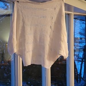 White knit sweater, with intentional stressed pulls, small in size , slouchy
